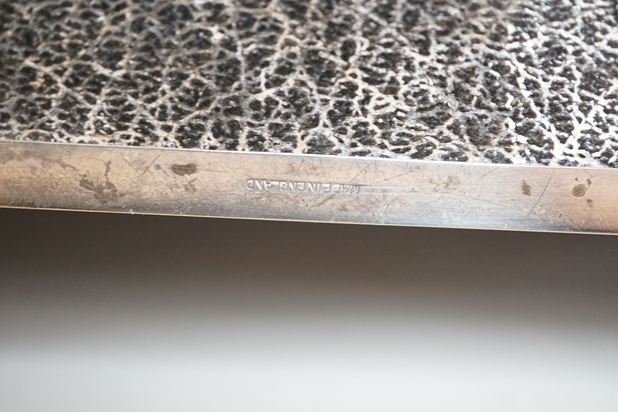 A late 1950's engine turned silver mounted rectangular cigarette box, with engraved inscription, 17.8cm.